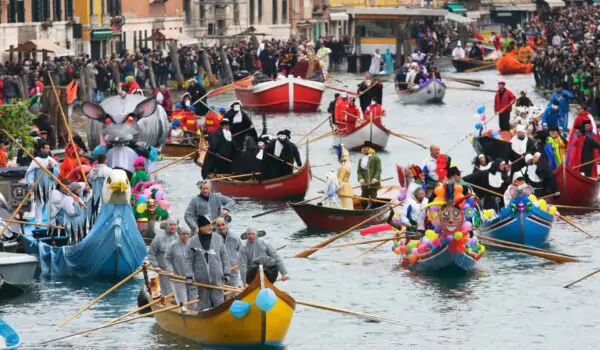 family-events-venice-italy Gondolas in Venice Italy during a colorful family event carnival